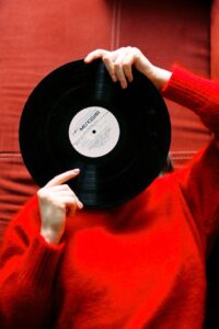 woman in red clothes with big disk