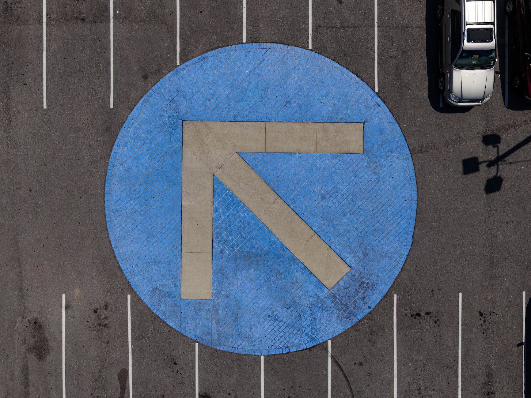 round blue and gray arrow symbol