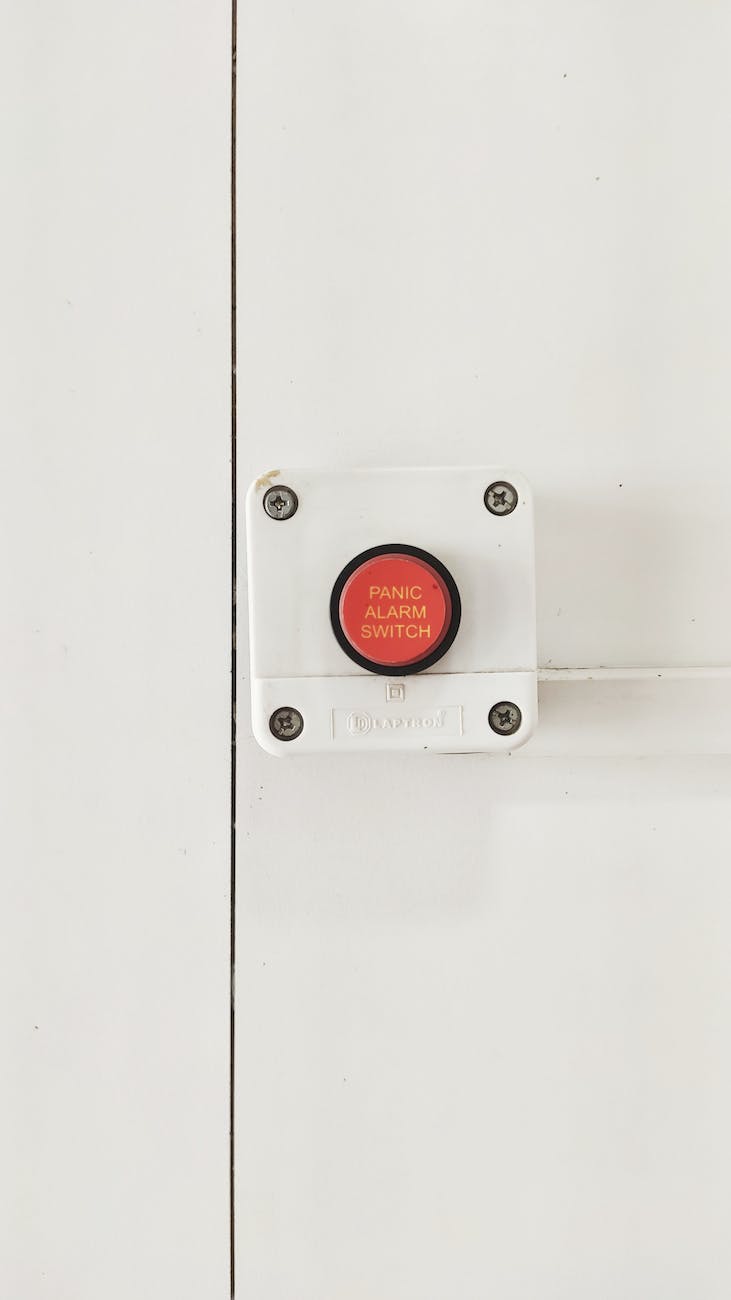 white and red panic alarm switch