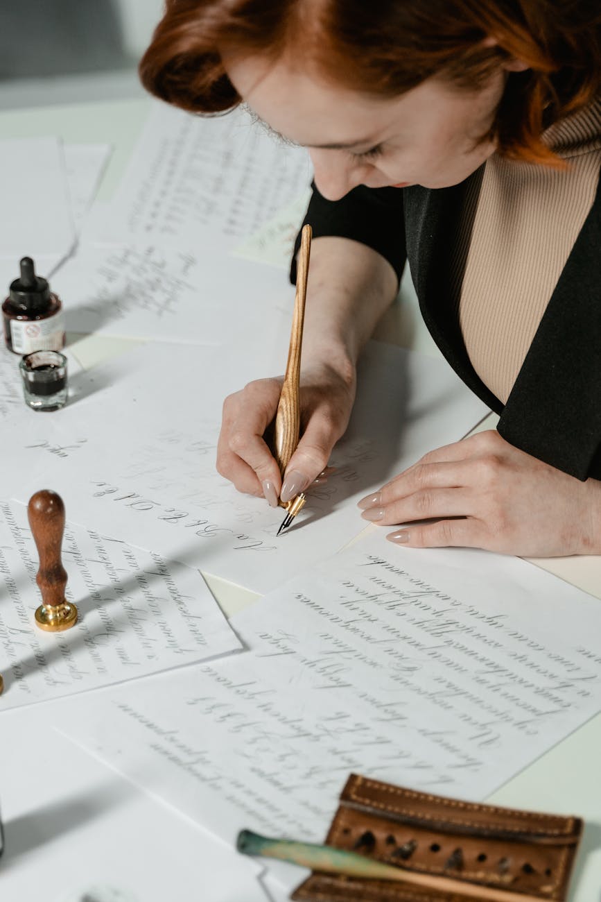 a woman writing on a paper